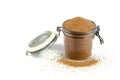 Brown cane sugar in glass jar isolated on white background Royalty Free Stock Photo