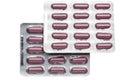 Brown capsules in a foil blister pack isolated on Royalty Free Stock Photo