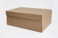 Brown cardboard shoes box with lid for shoe or sneaker product packaging mockup, isolated on white background with clipping path. Royalty Free Stock Photo