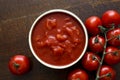 Brown ceramic bowl of chopped tinned tomatoes. Royalty Free Stock Photo