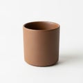 Brown ceramic cup with a matte finish, cylindrical shape, and smooth texture Royalty Free Stock Photo