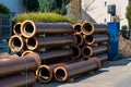 Brown ceramic pipes for laying water pipes stacked in stacks.