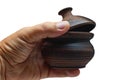 Brown ceramic sugar bowl in hand close-up. Isolated. Royalty Free Stock Photo