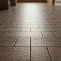 Brown ceramic tiles cover the floor, arranged in a rectangular pattern. The perspective Royalty Free Stock Photo