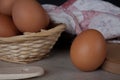 Brown chicken egg close up, fresh eggs in a wicker basket Royalty Free Stock Photo