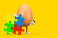 Brown Chicken Egg Person Character Mascot with Four Pieces of Colorful Jigsaw Puzzle. 3d Rendering Royalty Free Stock Photo