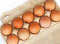 Brown chicken eggs in a carboard box