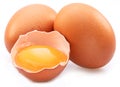 Brown chicken eggs and egg yolk isolated on white background Royalty Free Stock Photo