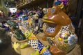 A brown china frog statue in a store