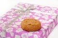 Brown chocolate cookie on the pink gift box Royalty Free Stock Photo