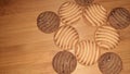 brown chocolate cookies isolated on wooden background
