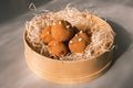 Brown chokolate sweet potato cake lie in a round wooden box on the table. homemade baking Royalty Free Stock Photo