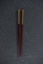 Brown chopsticks on slate plate