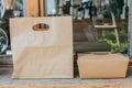 Brown clear empty blank craft paper bag and Kraft corrugated cardboard box with handle for takeaway.Packaging template mock up. De