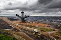 Digger and brown coal open cast mining Royalty Free Stock Photo