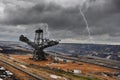 Digger and brown coal open cast mining Royalty Free Stock Photo