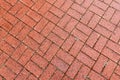 Brown cobble stone walkway get wet cause of rain. Pavement texture. Royalty Free Stock Photo