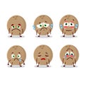 Brown coconut cartoon character with sad expression