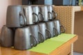 Brown coffee cups stacked on buffet table at the seminar Royalty Free Stock Photo