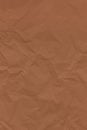 Brown color crumpled wrinkled textured paper background Royalty Free Stock Photo