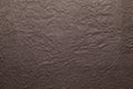 Brown color handmade paper of crumple or wrinkle texture with veins and fibers. Useful for background, 3d renderi