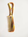 The brown comb contains hair fragments. Royalty Free Stock Photo