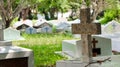 Brown concrete cross on tombstone in local graveyard concept is to remind people about death