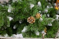 Brown cone on artificial Christmas tree, close-up Royalty Free Stock Photo