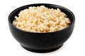 Brown cooked rice in a black ceramic bowl isolated on white Royalty Free Stock Photo