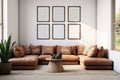 Brown corner sofa in the living room, coffee table and a set of 6 empty wooden frames for wall art mockup. Large windows and Royalty Free Stock Photo