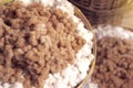 White and brown cottons in basket are ready to be spun to native yarns