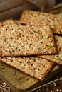 Brown crackers topped with seeds