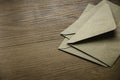 Brown craft envelope on a wooden background Royalty Free Stock Photo