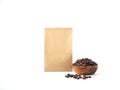 Brown craft paper bag packaging and wooden bowl for roasted coffee beans template isolated on a white background. Royalty Free Stock Photo