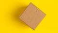 Brown craft paper or carton box with lid mock up on yellow background. Top view of blank small paper box. Brown cardboard box. Royalty Free Stock Photo