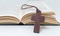 Brown cross and Holy Bible