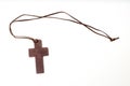 Brown crucifix isolated on white background Royalty Free Stock Photo