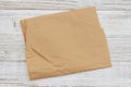 Brown crumpled butcher paper on weathered wood Royalty Free Stock Photo