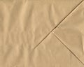Brown crumpled and folded paper texture background. Kraft bag bottom Royalty Free Stock Photo