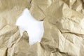 Brown crumpled paper texture That is punctured to create white spaces