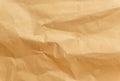 Brown crumpled wrapping paper background, texture of yellow wrinkled of old vintage paper, creases on the surface of paper