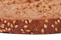 Brown crust of bread sprinkled with sesame seeds Royalty Free Stock Photo