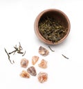 Brown crystal sugar and a tea cup with green tea Royalty Free Stock Photo