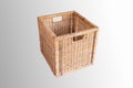 Brown cubic woven storage basket isolated on white side view Royalty Free Stock Photo