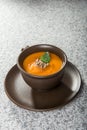 Brown cup with squash soup Royalty Free Stock Photo