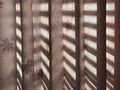 Brown curtain with shadow of the window shine through the fabric Royalty Free Stock Photo