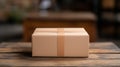 Brown delivery package on wooden table in indoor setting at daytime Royalty Free Stock Photo