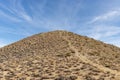 Brown desert hill with trail leading to the top Royalty Free Stock Photo