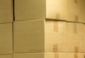 Brown different cardboard boxes arranged in stack. texture. background. Tape mounted. Transportation bags.