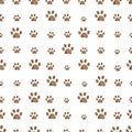 Brown doodle paw prints vector seamless background pattern for fabric design Royalty Free Stock Photo